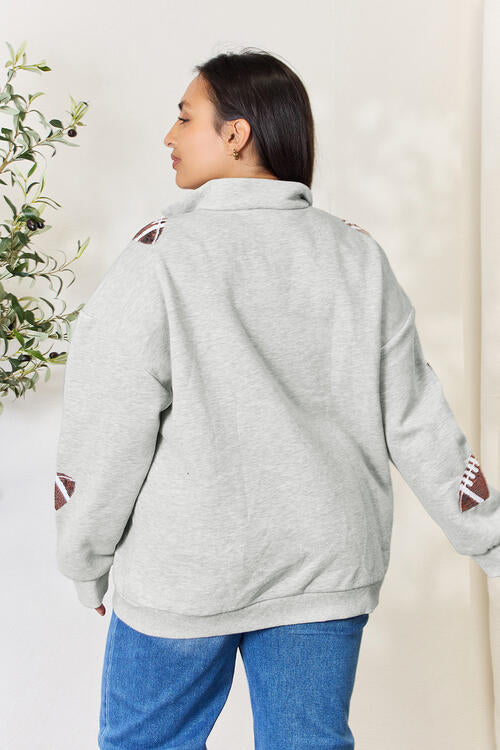 Double Take Full Size Sequin Football Half Zip Long Sleeve Sweatshirt